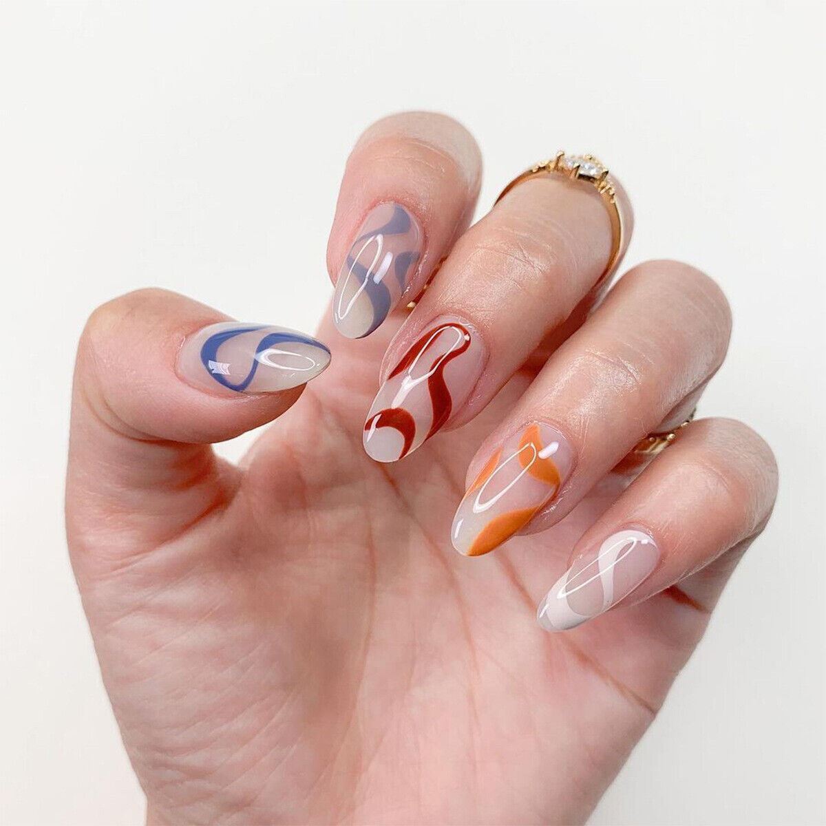 Hand with colorful nail art on a white background