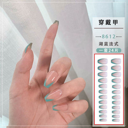 A hand displaying long French-tip press-on nails in a pale pink and teal-blue gradient, next to a white product information panel with Chinese text and a small sample sheet of matching nails.