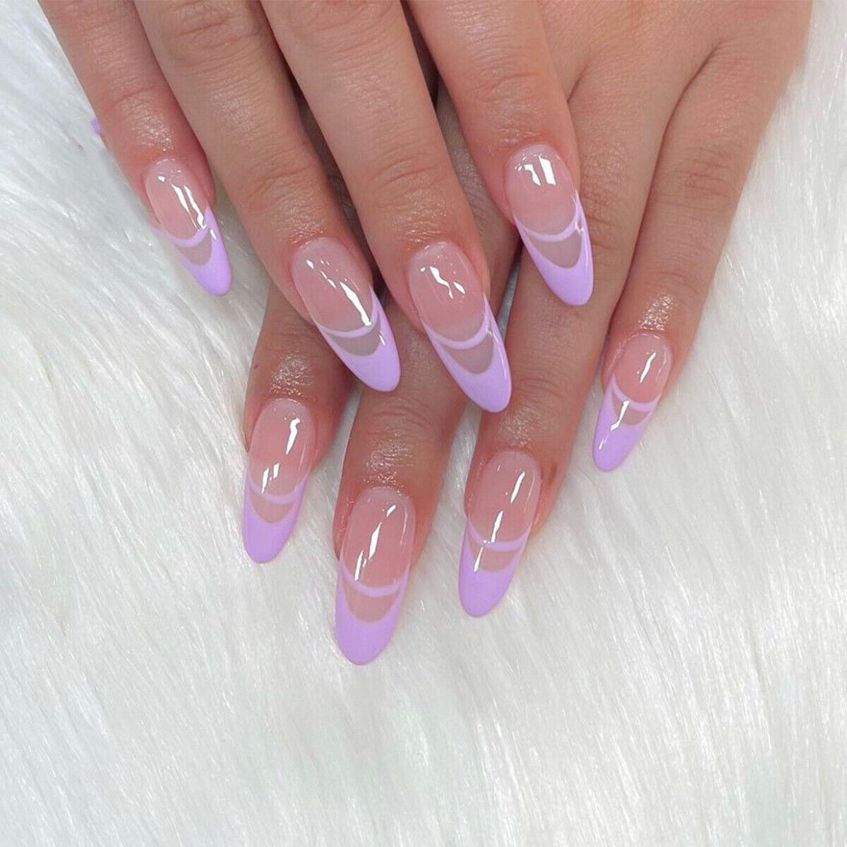 Close-up of hands with pink and purple gradient nails on a white background