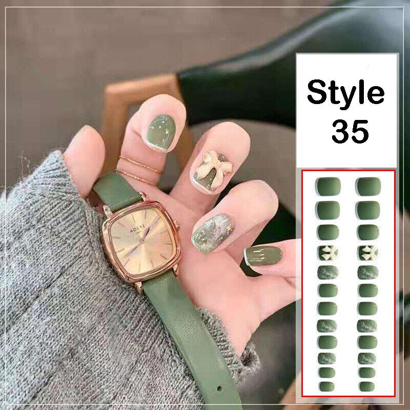 A hand wearing a green leather strap watch and green manicured nail stickers, with a side panel showing the style number 35 and a sheet of matching green nail stickers.
