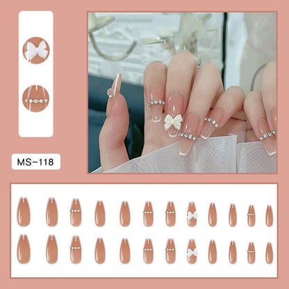Nail sticker set MS-1118 with almond-shaped nude tips, featuring white bow and pearl bead designs, shown both as individual pieces and applied to a hand.