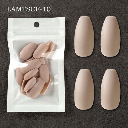 Nude-colored false press-on nails shown both inside a clear resealable pouch and as a pair of larger sample views on a dark textured background. Text in the top left reads LAMTSCF-10.