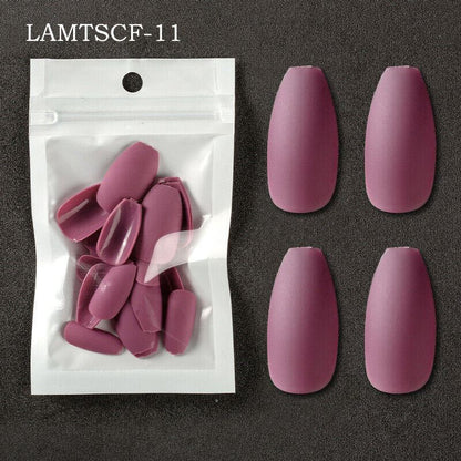 Muted mauve-pink coffin-shaped press-on nails shown next to their clear resealable pouch packaging on a dark textured background. The text 'LAMTSCF-11' is printed in the top left corner.