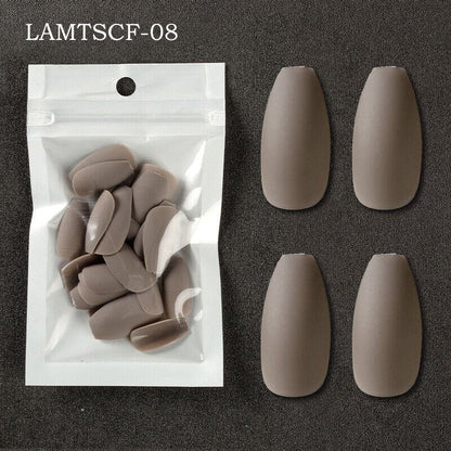Four taupe-brown almond-shaped press-on nails displayed next to their clear plastic packaging on a dark textured background, with the text 'LAMTSCF-08' in the top left corner.