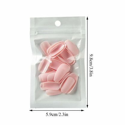 A clear plastic stand-up pouch containing several pale pink nail tips, shown with dimension arrows and text indicating 5.9cm/2.