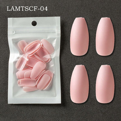 Four pink press-on nails displayed next to a clear plastic bag containing additional pink press-on nails, with the text 'LAMTSCF-04' in the top left corner, set against a dark gray textured background.