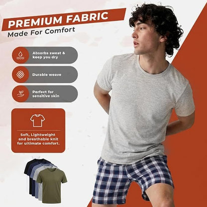 A man wearing a light gray short-sleeve t-shirt and blue-and-white plaid shorts, shown in a promotional graphic with text highlighting premium fabric comfort and a small inset of other shirt colors.