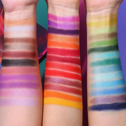 Three arms with colorful makeup swatches on a vibrant background