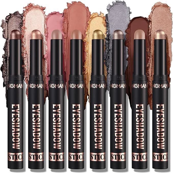 Eight black eyeshadow stick pencils with rose gold accents are lined up vertically, each showing a different eyeshadow color swatch behind it. The visible text on the sticks reads 'NGH 1A1N' and 'EYESHADOW STICK'.