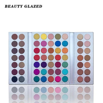 Makeup palette with various colors on a white background, branded 'BEAUTY GLAZED'.