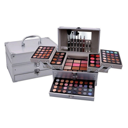 Makeup set with multiple palettes and applicators in a silver case on a white background