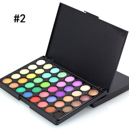 Makeup palette with various colors on a white background