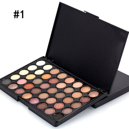 Makeup palette with various shades of eyeshadows on a white background