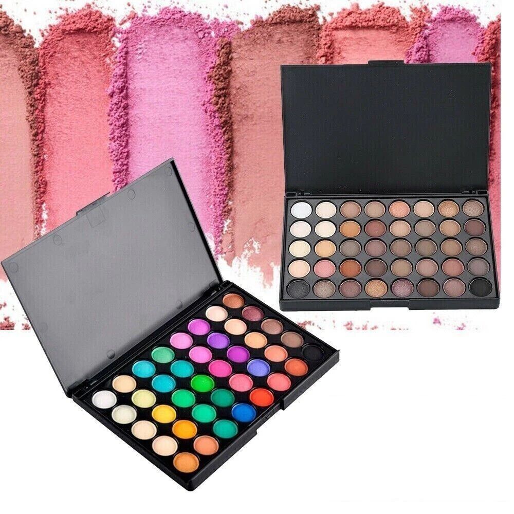 Makeup palettes with a variety of colors on a textured pink background