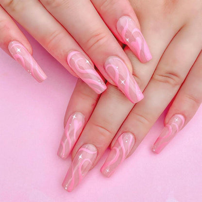Pink and clear acrylic nails on a pink background