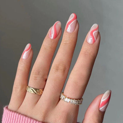 Hand with pink and white marbled nail polish on a gray background