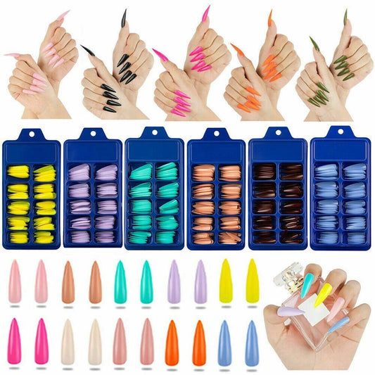 Nail color set display showing multiple blue trays of artificial nail tips in assorted shades, with sample nail tips arranged below, and hands demonstrating the nails applied in different colors on a white background.
