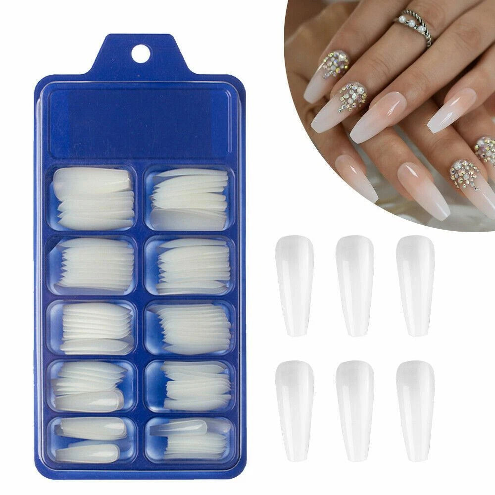 Nail art press-on set in a blue plastic tray, shown alongside eight individual clear false nails and a circular inset of hands wearing the nails decorated with rhinestones.