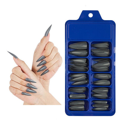 Blue tray of gray nail extensions with a hand model displaying the nails.