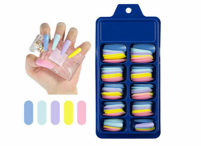 Nail art press-on set shown with a hand holding a clear bottle of loose press-on nails, a blue plastic organizer tray filled with stacked nail tips in pastel colors, and five color swatches below on a white background.
