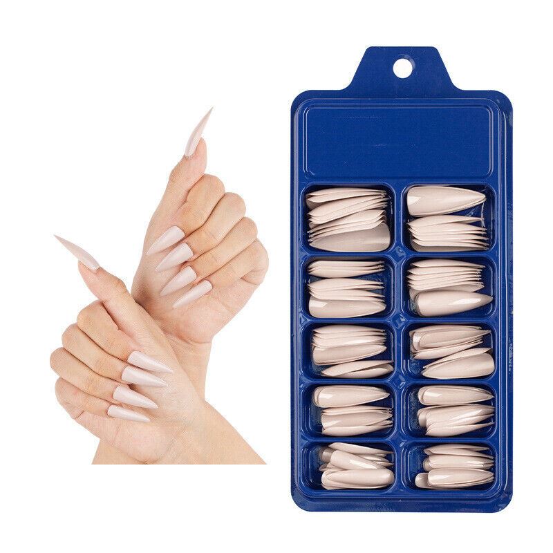 A set of false almond-shaped press-on nails in a translucent nude shade, shown both inside a blue plastic organizer tray and applied to a model's fingers against a white background.