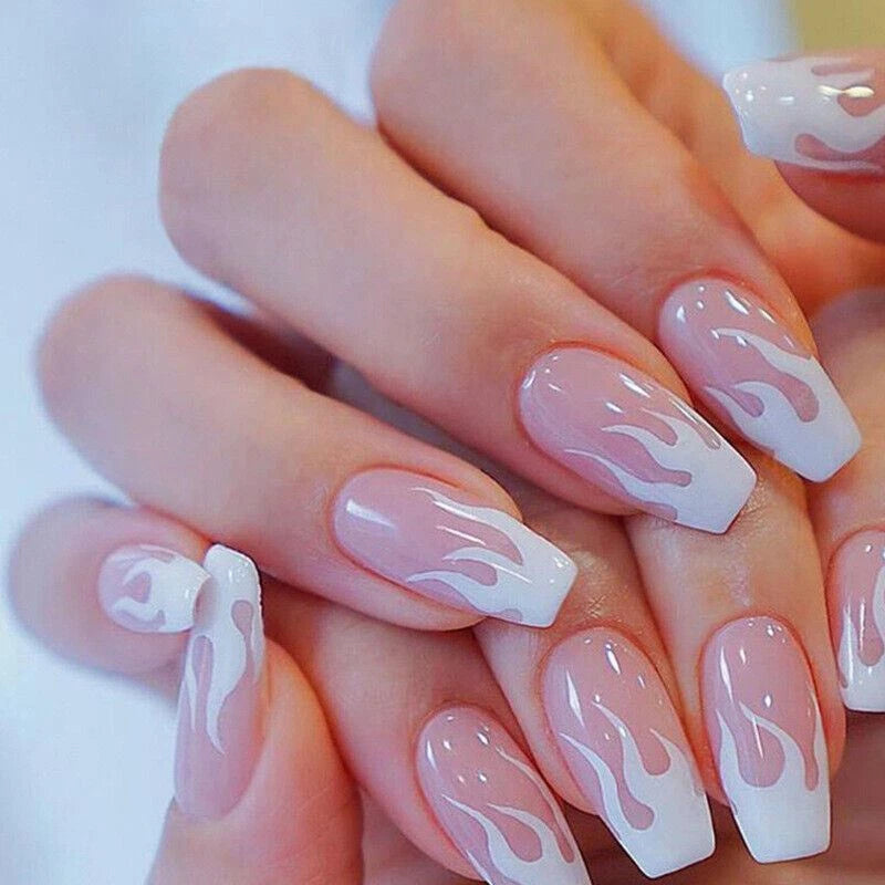 Nails with white flame design on a light background