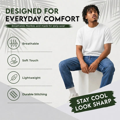 A man wearing a plain white short-sleeve t-shirt and blue jeans sits on a white block, with marketing text on a light gray background. The text highlights features like breathable fabric, soft touch, lightweight, and durable stitching, with the slogan 'STAY COOL LOOK SHARP'.