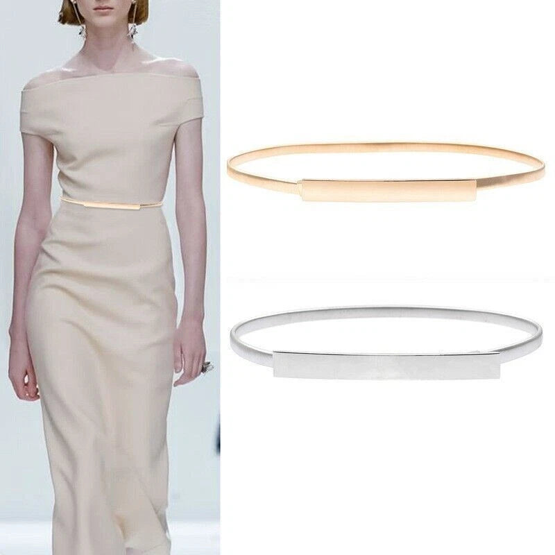 A model wears a fitted off-the-shoulder beige dress with a thin gold waistband, while the right side shows two minimalist bangle-style belt accessories in gold and silver on a white background.