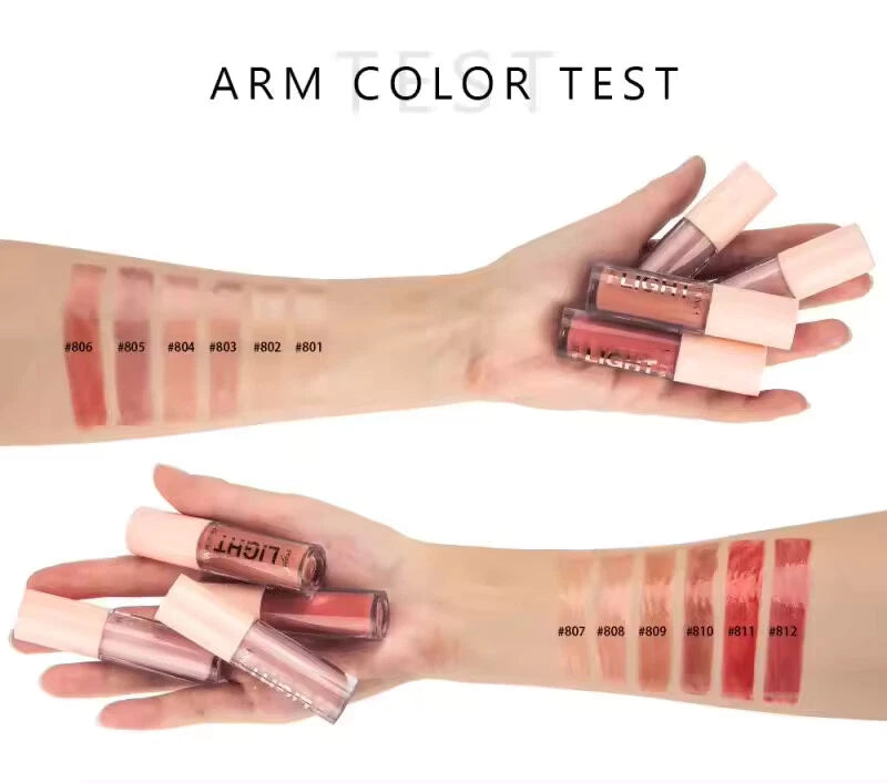Lip gloss swatches on arm with product packaging displayed.