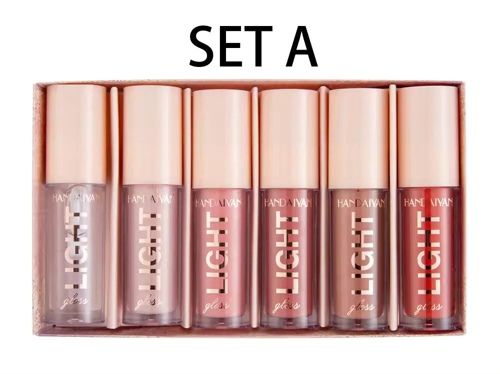 Set of Pan Nyeu lip glosses in a box labeled 'Set A' on a white background