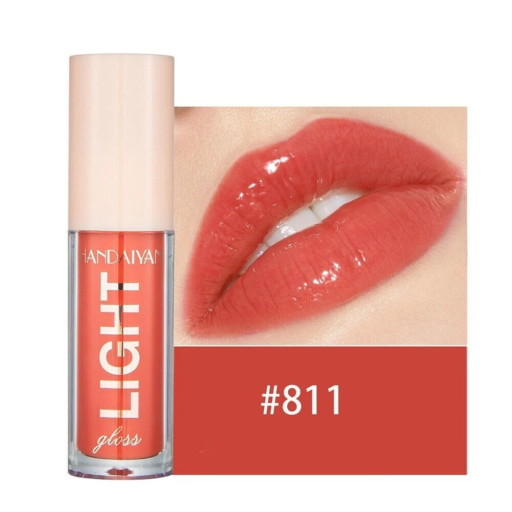 Lip gloss with a close-up of lips wearing the color, brand 'HAND AIYA' visible.