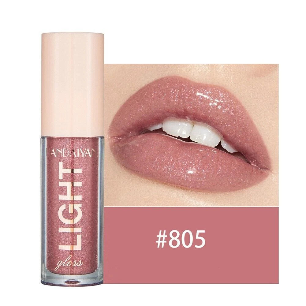 Lip gloss with a close-up of lips wearing the color, brand 'Huda Beauty' visible.