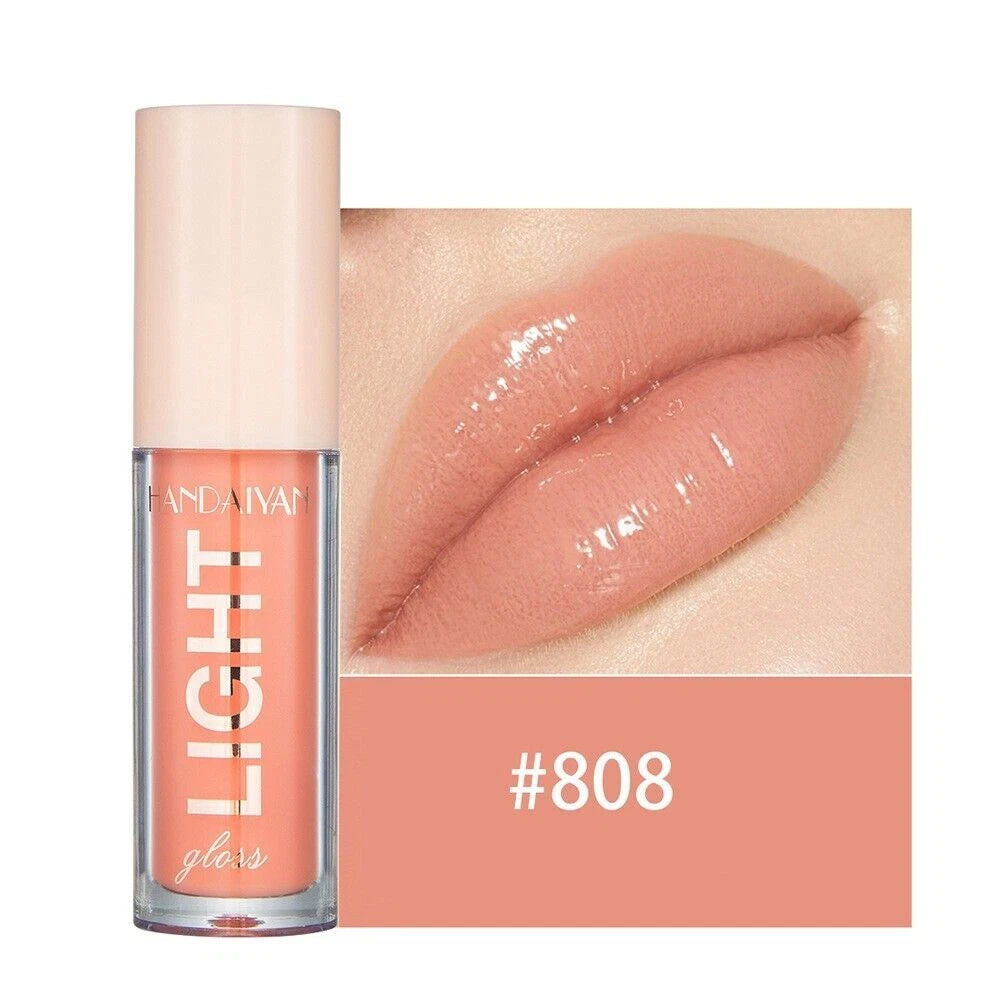 Lip gloss with a close-up of lips wearing the color, brand 'Huda Beauty' visible.