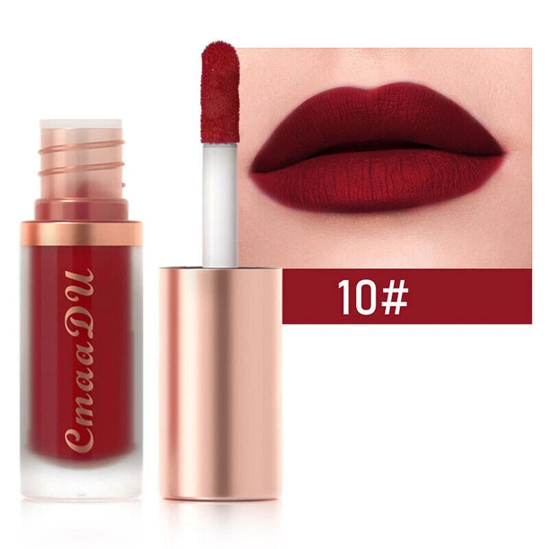 Red lipstick with rose gold casing and 'Cmaa DU' branding, applied on lips.