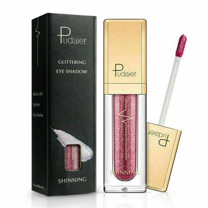 Pudaier Shinning Glittering Eye Shadow in a metallic pink shade, shown with its black and gold packaging box, the open tube, and the applicator wand on a white background.